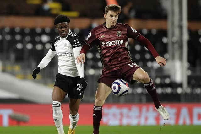 THRIVING: Leeds United's Spanish international centre-back Diego Llorente, right, stays ahead of Fulham's Josh Maja in in Friday night's 2-1 victory at Craven Cottage. Photo by Matt Dunham - Pool/Getty Images.