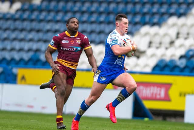 Jack Broadbent en-route to scoring for Rhinos against Huddersfield. Picture by Tony Johnson.