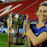Rhinos captain Courtney Hill with the Betfred Women's Super League trophy. Picture by Steve Riding.