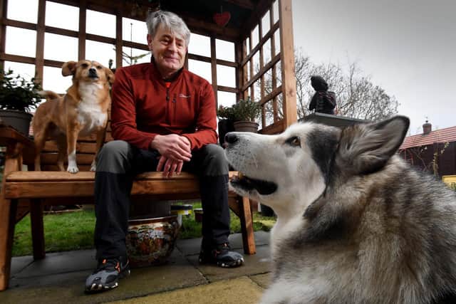 Vic Ferguson pictured with his dogs Mishka and Amber.

Picture by Simon Hulme