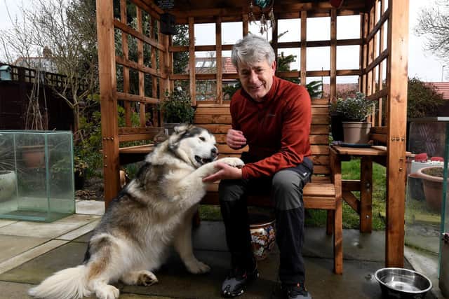 Vic Ferguson pictured with his dogs Mishka and Amber.

Picture by Simon Hulme