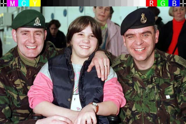 Hurmija Mujic is pictured in February 2012 with  Sergeant Major Vic Ferguson from Leeds (left) and Petty Officer Phil Ball from Poole who helped to highlight her plight as she languished in a Sarajevo Hospital.

Photo: Tim Ockenden/PA.