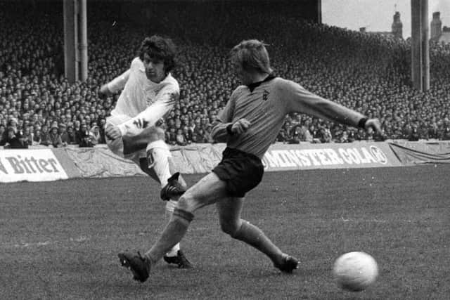 HOT SHOT: Leeds United's Peter Lorimer, left, powers the ball past Wolves defender Derek Parkin back in April 1973. Picture by YPN.