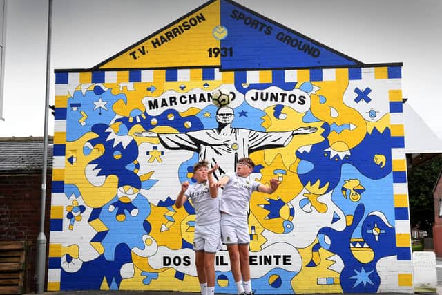 Mural showing Leeds United Coach Marcelo Bielsa, by artists Andy McVeigh and Nicolas Dixon at Oldfield Lane, Wortley. Identical twins Kailen Hatfield (right) and his brother Mason Hatfield. aged 12, pictured by the mural Photo: Simon Hulme.
