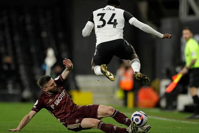 VERSATILE: Leeds United's Stuart Dallas tackles Fulham's Ola Aina during Friday night's 2-1 victory at Craven Cottage. Photo by MATT DUNHAM/POOL/AFP via Getty Images.