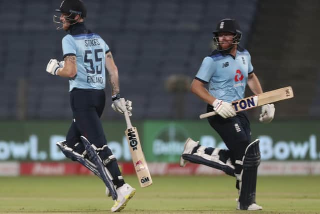 England's Ben Stokes, left, and Jonny Bairstow run between the wickets to score during the second One Day International. (AP Photo/Rafiq Maqbool)