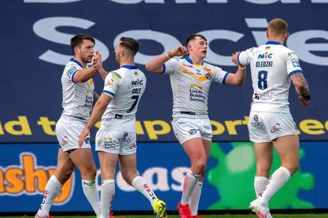 Jack Broadbent, third from left, celebrates his firfst Super League try. Picture by Bruce Rollinson.