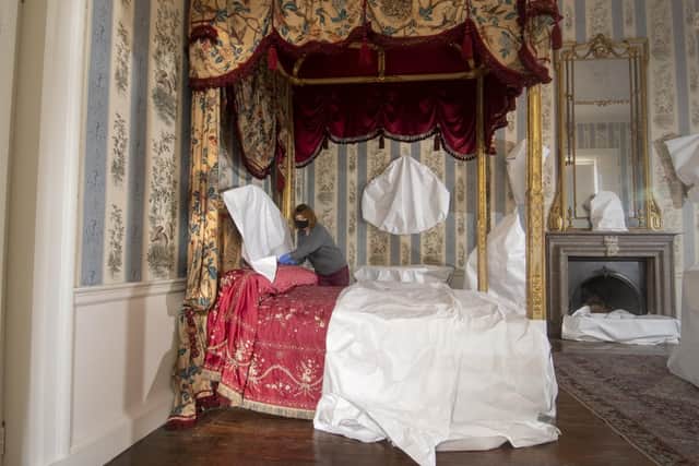 Conservator Emma Bowron wraps up the bed in Lady Isabella Hertford’s former quarters at Temple Newsam. PIC: Tony Johnson