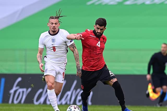 SIXTH CAP: England's Leeds United midfielder Kalvin Phillips, left, battles for possession with Albania's Elseid Hysaj during Sunday night's World Cup qualifier in Tirana. Photo by Mattia Ozbot/Getty Images.
