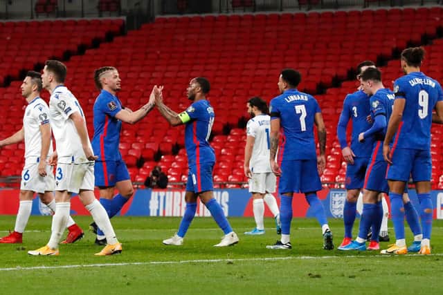 EXALTED COMPANY: Leeds United midfielder Kalvin Phillips, third left, congratulates England team mate Raheem Sterling after his strike in Thursday's 5-0 victory against San Marino. Photo by Frank Augstein - Pool/Getty Images.
