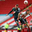 TRAINING KNOCK - Chris Basham, pictured battling with Rodrigo, could return from a knock sustained in training to face Leeds United at Elland Road. Pic: Getty
