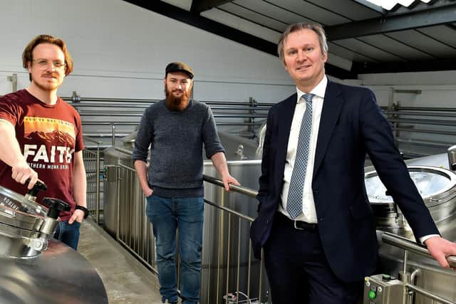 (From left) Russell Bisset and  Brian Dickson of Northern Monk with Jonathan Pollard, of Ward Hadaway. Picture: Eddie Garvey