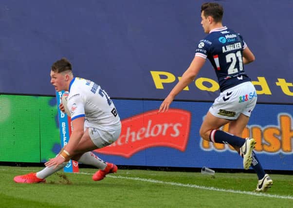 CLINCHER: Jack Broadbent scoring the winning try for Leeds Rhinos against Wakefield Trinity. Picture: Steve Riding.