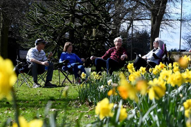 Two families share a joke amongst the Daffodils at Roundhay Park, Leeds, on the day families can meet up outside. Picture by Simon Hulme