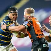 Ava Seumanufagai is tackled by Castleford's Paul McShane during his final Headingley appearance for Leeds last October. Picture by Allan McKenzie/SWpix.com.