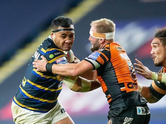 Ava Seumanufagai is tackled by Castleford's Paul McShane during his final Headingley appearance for Leeds last October. Picture by Allan McKenzie/SWpix.com.