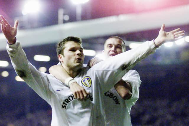 Former Leeds United striker Mark Viduka celebrates with Dom Matteo at Elland Road. Pic: David Davies (PA)
