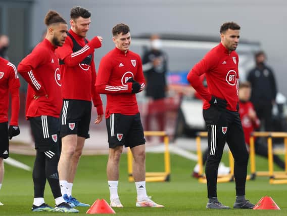 MOVING ON - Rob Page says Wales have dealt with the issue involving Leeds United attacker Tyler Roberts, left, and Hal Robson Kanu, right, and there will be no further ramifications. Pic: Getty