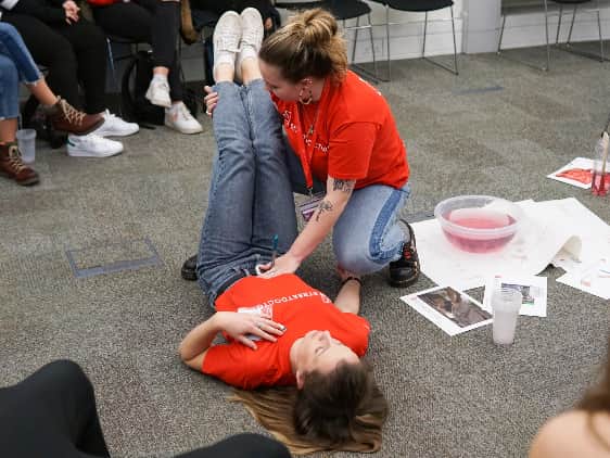 StreetDoctors nurses demonstrating how to save a life if someone is stabbed