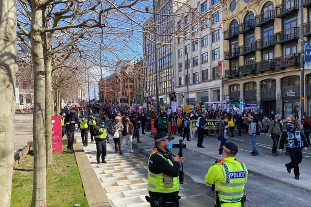 Protesters march through the city centre