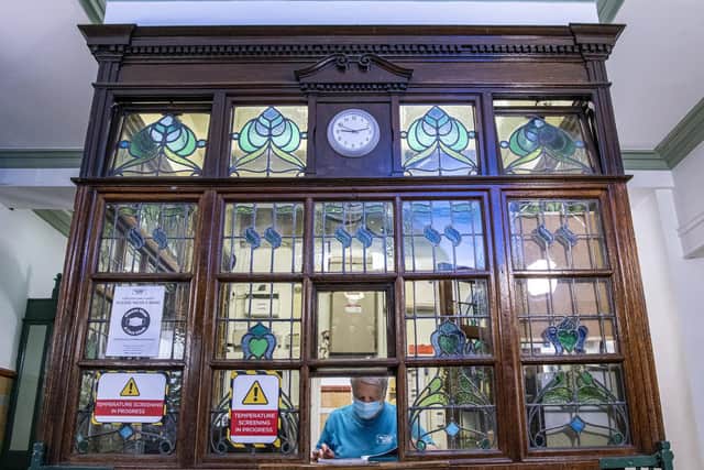 The original Edwardian ticket office remains in tact, with its stunning stained glass features. Photo: Tony Johnson