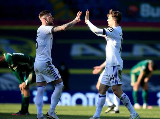 Leeds United captain Liam Cooper celebrates with Diego Llorente at full-time. Pic: Getty