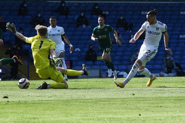 CLOSE: Leeds United winger Jack Harrison, right, is thwarted by Aaron Ramsdale, left, in his bid for a second goal in Saturday's 2-1 win against Sheffield United at Elland Road. Picture by Jonathan Gawthorpe.