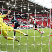 LEAVING IT LATE: Patrick Bamford, centre, and Leeds United finally beat Sheffield United and 'keeper Aaron Ramsdale in the 88th minute of September's clash against Sheffield United at Bramall Lane, above. Photo by Alex Livesey/Getty Images.