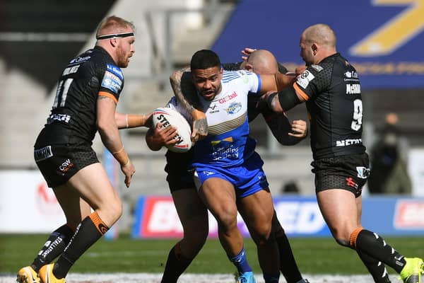 TOUGH DAY: Leeds Rhinos' Kruse Leeming finds his path blocked by Castleford Tigers at the TW Stadium. Picture: Jonathan Gawthorpe