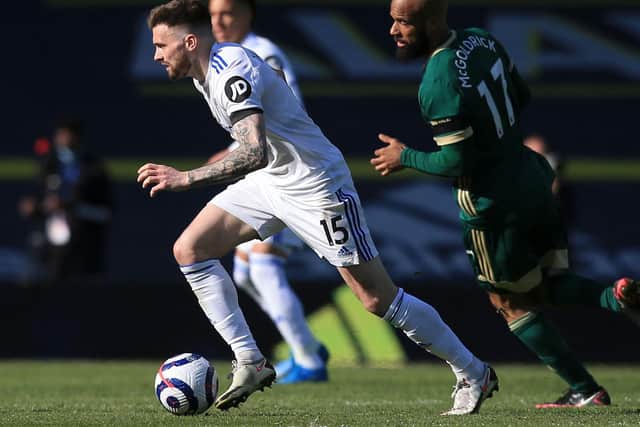 KEEPING AHEAD: Leeds United's Stuart Dallas, left, is chased by Sheffield United's David McGoldrick in Saturday's clash at Elland Road. Photo by LINDSEY PARNABY/POOL/AFP via Getty Images.