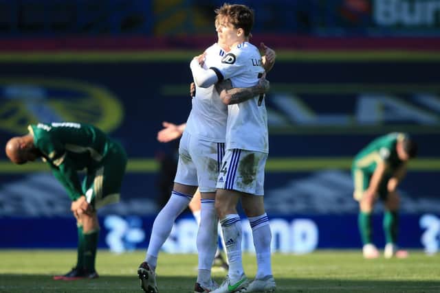 VICTORY HUG: Leeds United centre-back partners Liam Cooper, left, and Diego Llorente, right, embrace after Saturday's 2-1 victory against Sheffield United at Elland Road. Picture by Lindsey Parnaby/PA Wire.