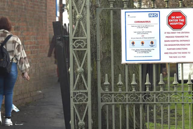 A sign about the coronavirus at an entrance to York Hospital