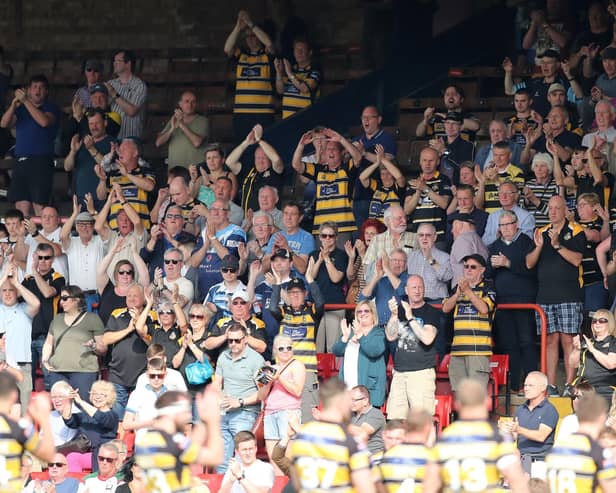 Fans of York City Knights applaud their team.