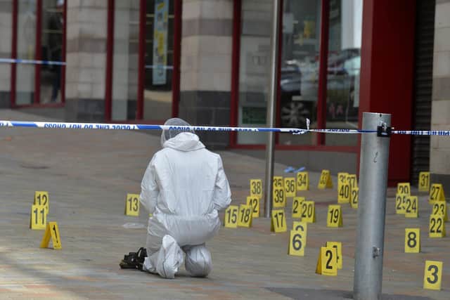 Police work at the scene of a stabbing in Boar Lane, Leeds, in May 2018. Picture: Bruce Rollinson