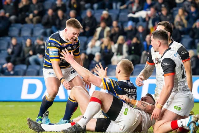 Callum McLelland, left, celebrates after Mikolaj Oledzki's try against Toronto Wolfpack.