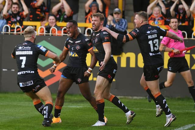 Jason Qareqare, second from left, celebrates his debut try alongside Tigers teammates, from left to right, Danny Richardson, Michael Shenton and Adam Milner. Picture by Jonathan Gawthorpe.