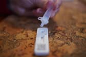 A woman taking a lateral flow test in a household in Devon. The UK Health Security Agency have said people in England without coronavirus symptoms who have a positive lateral flow test will no longer need a confirmatory PCR test from January 11