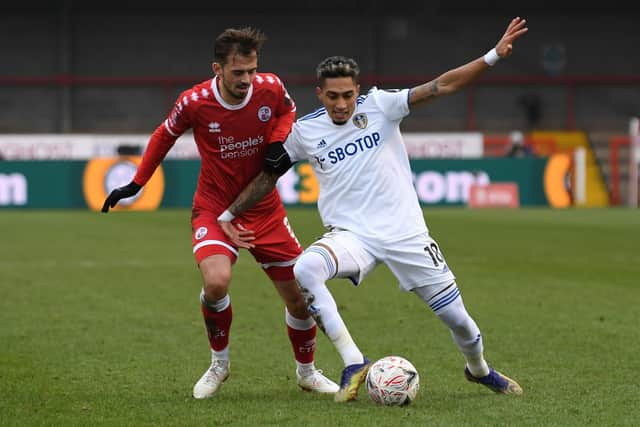 Raphinha holds off Jack Powell during Crawley Town's 3-0 win over Leeds United in the Third Round of the FA Cup in January 2021. Pic: Stu Forster.