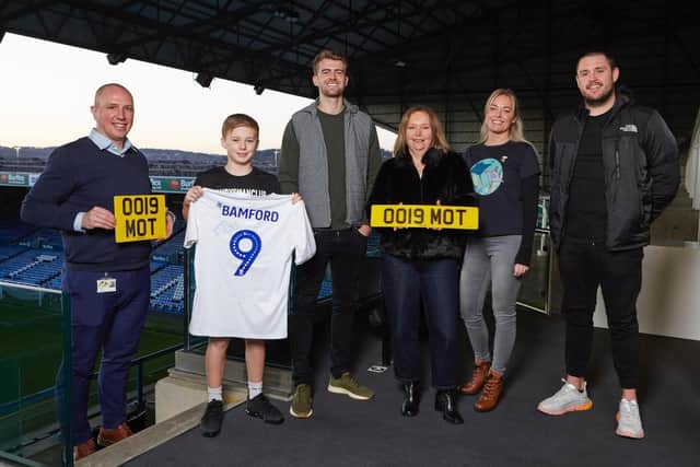 PRIZE WINNER - Patrick Bamford raffled off his limited edition Leeds United centenary shirt and Whites-inspired registration plates to benefit three charities.