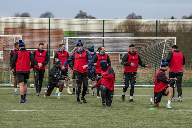 Trinity players warm-up before training at Dewsbury today (Thursday). Picture by Tony Johnson.