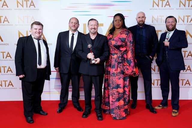 Ricky Gervais (centre) and the cast and crew of After Life in the press room after winning the Comedy award at the National Television Awards 2021.