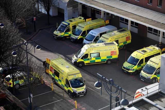Figures show that across Yorkshire and the North East, 8,788 staff were off with Covid or self isolating on January 2. Ambulance are pictured parked outside Leeds General Infirmary hospital in Leeds (OLI SCARFF/AFP via Getty Images).