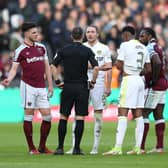 COSTLY CALL: Leeds United's Luke Ayling leads the remonstrating with referee Stuart Attwell after Manuel Lanzini's strike in Sunday's FA Cup defeat at West Ham. Photo by Alex Pantling/Getty Images.