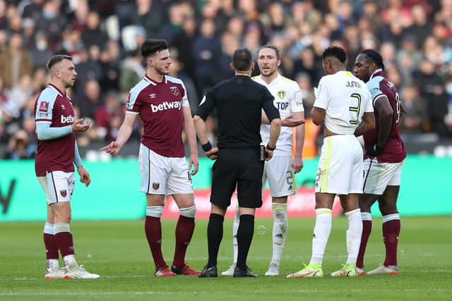COSTLY CALL: Leeds United's Luke Ayling leads the remonstrating with referee Stuart Attwell after Manuel Lanzini's strike in Sunday's FA Cup defeat at West Ham. Photo by Alex Pantling/Getty Images.