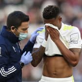 Junior Firpo receives medical attention during Leeds United's 2-0 FA Cup defeat to West Ham United. Pic: Alex Pantling.