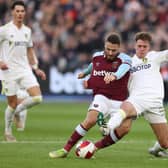 Man-of-the-match contender Leo Hjelde tussles with West Ham's Nikola Vlasic during the Emirates FA Cup third-round match at the London Stadium. Picture: Alex Pantling/Getty Images.