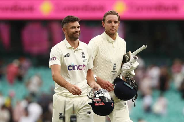 We've done it: England's James Anderson and Stuart Broad celebrate after earning a draw.