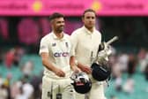 We've done it: England's James Anderson and Stuart Broad celebrate after earning a draw.