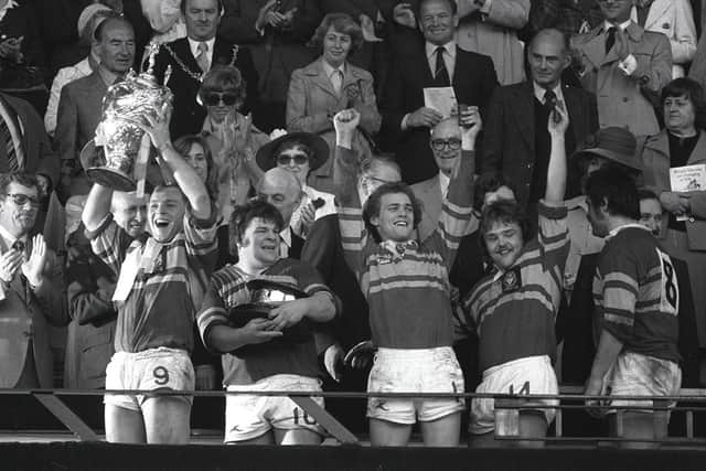 Kevin Dick shows off his medal as David Ward lifts the Challenge Cup trophy in 1978. Picture: Steve Riding.