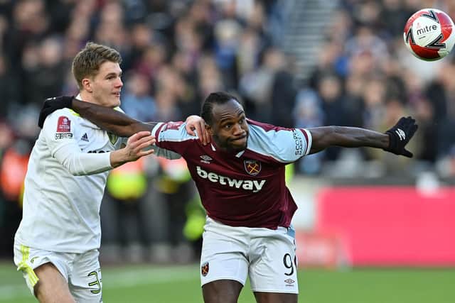 IMPRESSIVE DEBUT: Eighteen-year-old Leeds United defender Leo Hjelde, left, keeps tabs on West Ham's powerhouse striker Michail Antonio on his first ever outing for the Whites. Photo by JUSTIN TALLIS/AFP via Getty Images.